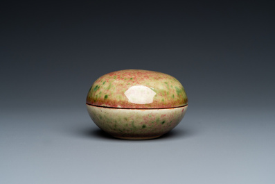 A Chinese peachbloom-glazed seal paste box, Kangxi mark, 19th C.