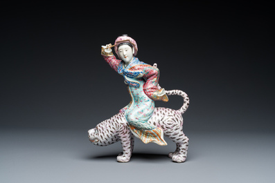 A Chinese famille rose group with a tiger and his rider, 19/20th C.