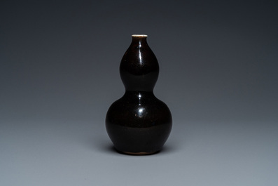 A small Chinese black-glazed double gourd vase and a blue crackle-glazed saucer dish, Qing