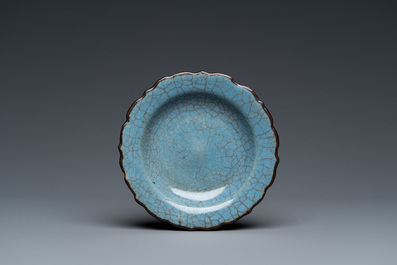A small Chinese black-glazed double gourd vase and a blue crackle-glazed saucer dish, Qing