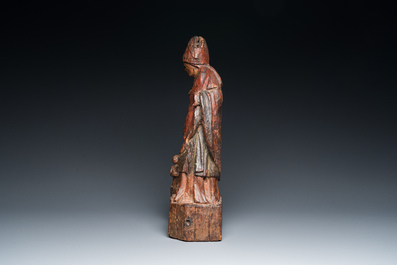 A polychromed wooden sculpture of Saint Nicholas with three bathing boys, 15/16th C.