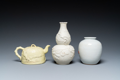 A Chinese yellow-glazed biscuit teapot, a white-glazed biscuit double gourd vase and an iron-red 'phoenix' jar, 20th C.