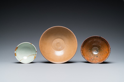 A Chinese Jian bowl, a qingbai bowl with kintsugi repair and a 'lotus' bowl, Song or later