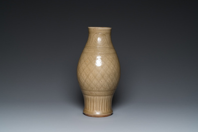 A Chinese Longquan celadon vase with underglaze design, Yuan or later