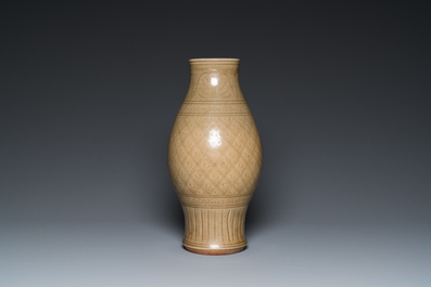 A Chinese Longquan celadon vase with underglaze design, Yuan or later