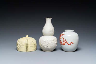 A Chinese yellow-glazed biscuit teapot, a white-glazed biscuit double gourd vase and an iron-red 'phoenix' jar, 20th C.