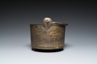 A bronze tripod kettle with handle, probably France, 17th C.