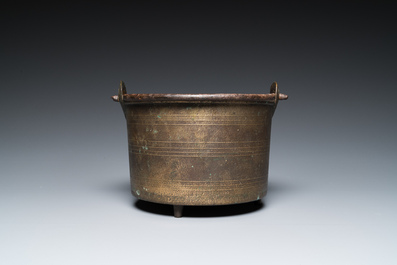 A bronze tripod kettle with handle, probably France, 17th C.