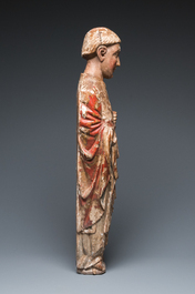 A large polychromed wood sculpture of a saint, Spain or Italy, 14th C.