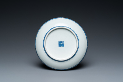 A Chinese blue, white and underglaze red dish, Qianlong mark, 19/20th C.