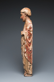 A large polychromed wood sculpture of a saint, Spain or Italy, 14th C.