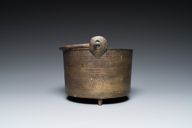 A bronze tripod kettle with handle, probably France, 17th C.