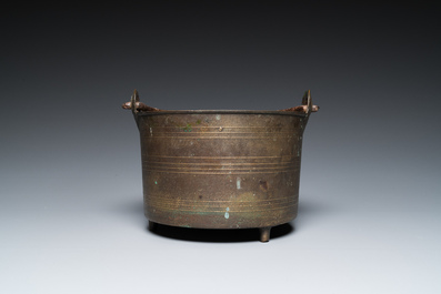 A bronze tripod kettle with handle, probably France, 17th C.