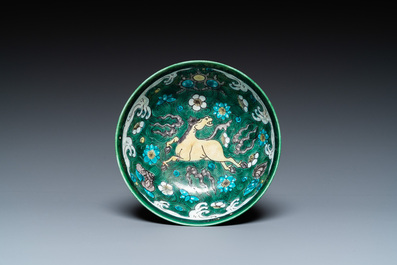 A Chinese verte biscuit 'galloping horses' bowl, Qing