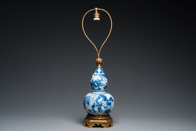 A Chinese blue and white double gourd vase mounted as a lamp, Transitional period