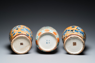 A Chinese Canton famille rose rouleau vase and a pair of Nanking vases, 19th C.
