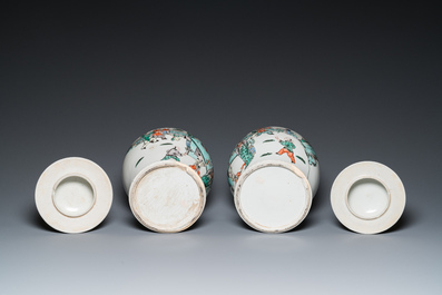 A pair of Chinese famille verte vases with covers and a pair of Nanking vases, 19th C.