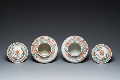 A pair of Chinese famille verte vases with covers and a pair of Nanking vases, 19th C.