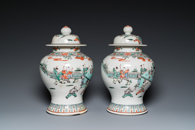 A pair of Chinese famille verte vases with covers and a pair of Nanking vases, 19th C.