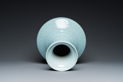 A Chinese monochrome claire-de-lune-glazed 'lotus scroll' vase, 'hu', Qianlong mark but probably later