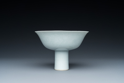 A Chinese monochrome white-glazed stem cup with anhua dragon design, Qianlong mark, 18/19th C.