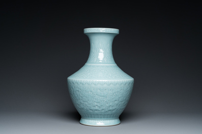 A Chinese monochrome claire-de-lune-glazed 'lotus scroll' vase, 'hu', Qianlong mark but probably later