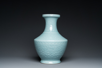 A Chinese monochrome claire-de-lune-glazed 'lotus scroll' vase, 'hu', Qianlong mark but probably later