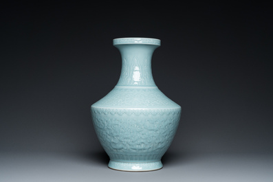A Chinese monochrome claire-de-lune-glazed 'lotus scroll' vase, 'hu', Qianlong mark but probably later