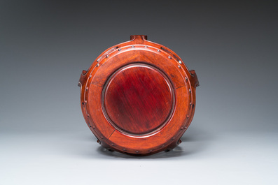 A Chinese wooden drum-form stand or seat, 19/20th C.