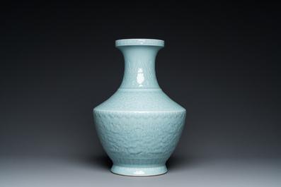 A Chinese monochrome claire-de-lune-glazed 'lotus scroll' vase, 'hu', Qianlong mark but probably later