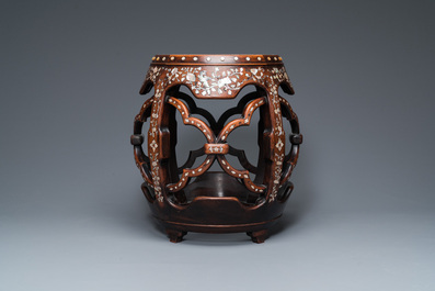 A Chinese mother-of-pearl-inlaid huali wooden drum-form stand or seat, Qing