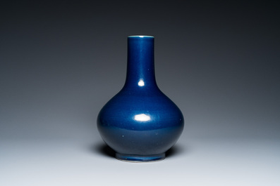 A Chinese monochrome 'sacrificial blue' bottle vase, 18/19th C.