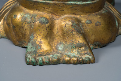 A large Chinese gilt bronze oil lamp in the shape of a kneeling figure, after a Han Dynasty example