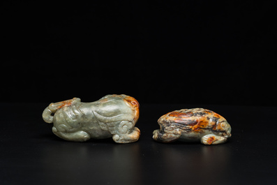 Two Chinese celadon and russet jade Buddhist lion sculptures, Qing