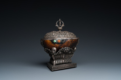 A Tibetan ritual silver-, coral- and turquoise-mounted 'kapala' or skull-bowl, 19th C.