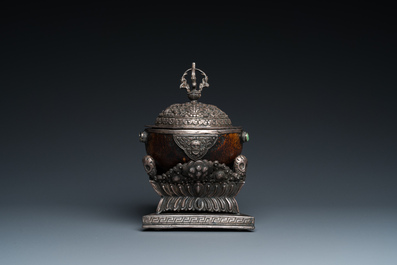 A Tibetan ritual silver-, coral- and turquoise-mounted 'kapala' or skull-bowl, 19th C.