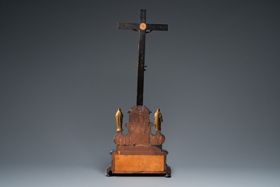 An ebonised wooden reliquary crucifix with gilt bronze corpus, Germany or Italy, 17/18th C.