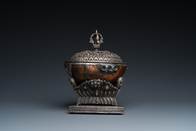 A Tibetan ritual silver-, coral- and turquoise-mounted 'kapala' or skull-bowl, 19th C.