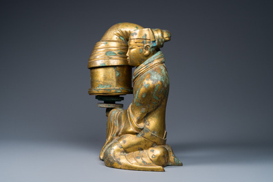 A large Chinese gilt bronze oil lamp in the shape of a kneeling figure, after a Han Dynasty example