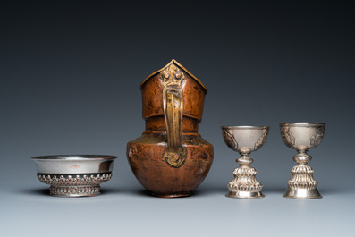 Two Tibetan silver stem bowls, a silvered bowl and a copper 'sengmaohu' ewer, 17/19th C.