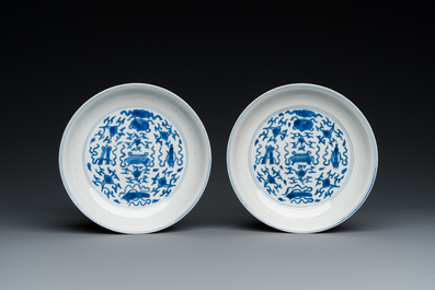 A pair of Chinese blue and white 'antiquities' plates, Kangxi mark and of the period