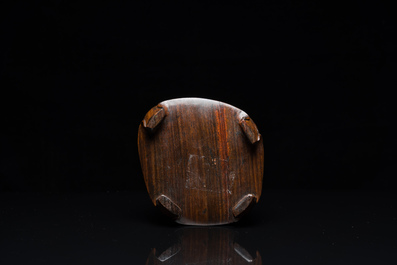 A Chinese hollowed jade libation cup on wooden stand, probably Qing