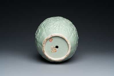 A Chinese relief-molded monochrome celadon-glazed vase, 19/20th C.