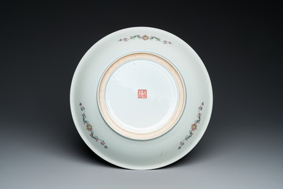A Chinese famille rose dish with figures in a garden, Qianlong mark, Republic