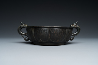 A Chinese archaistic bronze dragon-handled censer, Yuan