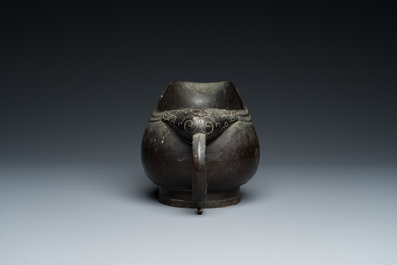 A rare Chinese inscribed archaistic bronze 'Yi' pouring vessel, Zhenghe, Northern Song