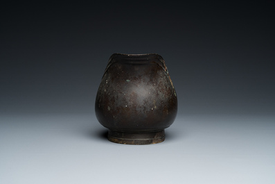 A rare Chinese inscribed archaistic bronze 'Yi' pouring vessel, Zhenghe, Northern Song