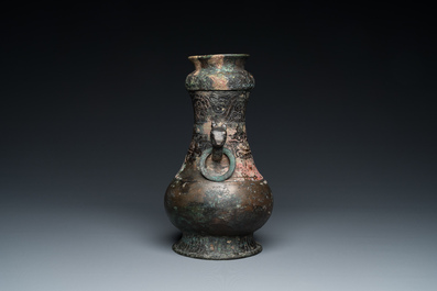 A Chinese ritual bronze 'hu' wine vessel and cover, Eastern Zhou or earlier