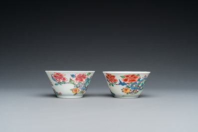 A pair of Chinese famille rose cups and saucers, Yongzheng