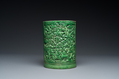 A Chinese monochrome green-glazed relief-molded brush pot, 19th C.